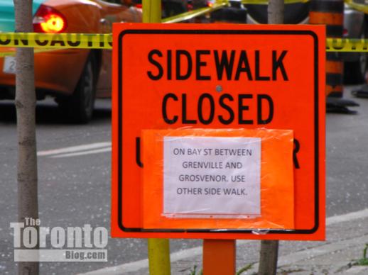 sidewalk closure sign on Bay Street