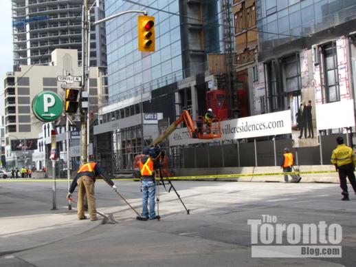 Television crews filming outside the Four Seasons Toronto construction site 
