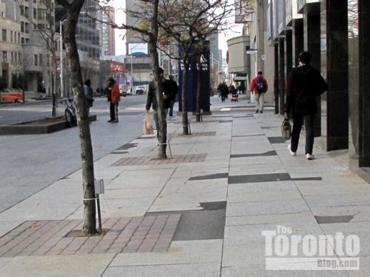 unrenovated Bloor Street sidewalk outside 120 Bloor Street East 