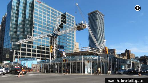 One Bloor condo construction is now visible above the sidewalk hoarding