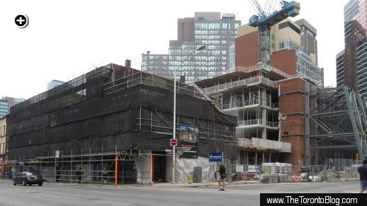 FIVE Condos tower construction viewed from the east side of Yonge Street at St Joseph Street